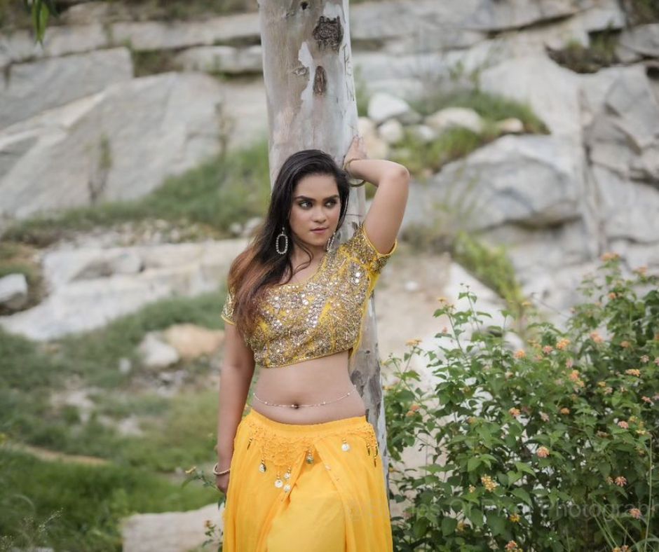 Kirthana captivating beauty shines in a yellow saree, a vision of elegance.